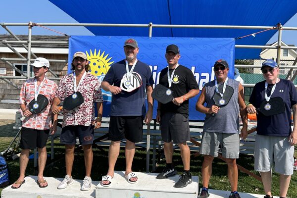 Competitors pose with their medals at the 2023 "LBI Pickleball at the Beach Tournament" | Image by Craig Batten