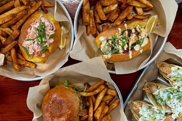 Various delicious Sandwiches led by the illustrious Lobster Roll | Image by Dock and Claw Clam Bar